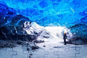 Traveler in ice cave, Vatnajokull National Park jigsaw puzzle