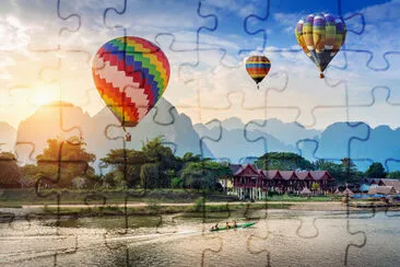 Hot air balloon over Nam Song river at sunset in V jigsaw puzzle