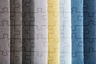 pieces of colorful fabric as a textured background jigsaw puzzle