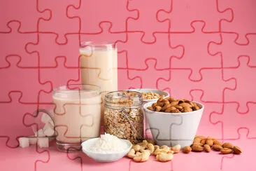 Assortment of tasty vegan milk on color background jigsaw puzzle