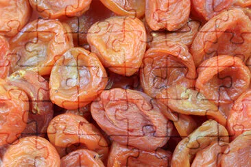 Fresh ripe dried apricot fruits as an element of t jigsaw puzzle