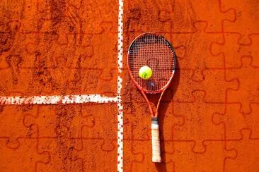 Tennis Ball on Tennis Racket on Floor jigsaw puzzle