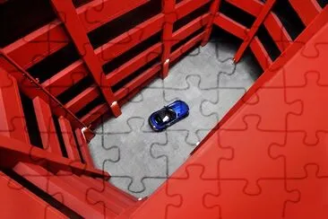 Blue Car in Red Parking Lot jigsaw puzzle