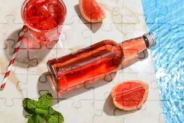 Bottle of fresh grapefruit soda near the Pool jigsaw puzzle