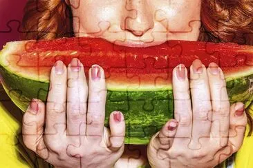 Woman biting into a slice of watermelon jigsaw puzzle