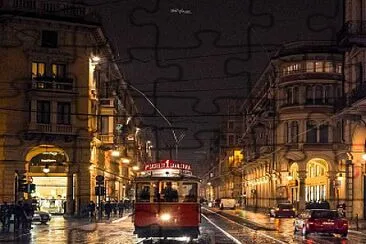 tram torino notte pioggia luci riflessi