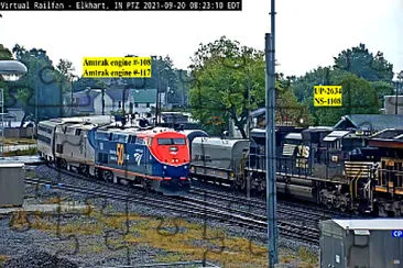 Amtrak engines 108 and 117 overtaking oil tanker train, Elkhart,IN/USA