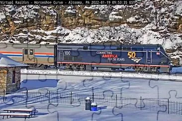 Amtrak engine #-100 leading train #-42 around Horseshoe Curve,PA/USA