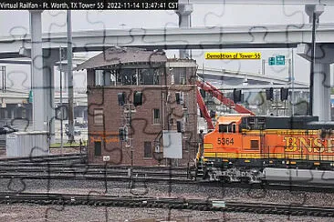 BNSF-5364 passing    "Tower-55 " being demolished